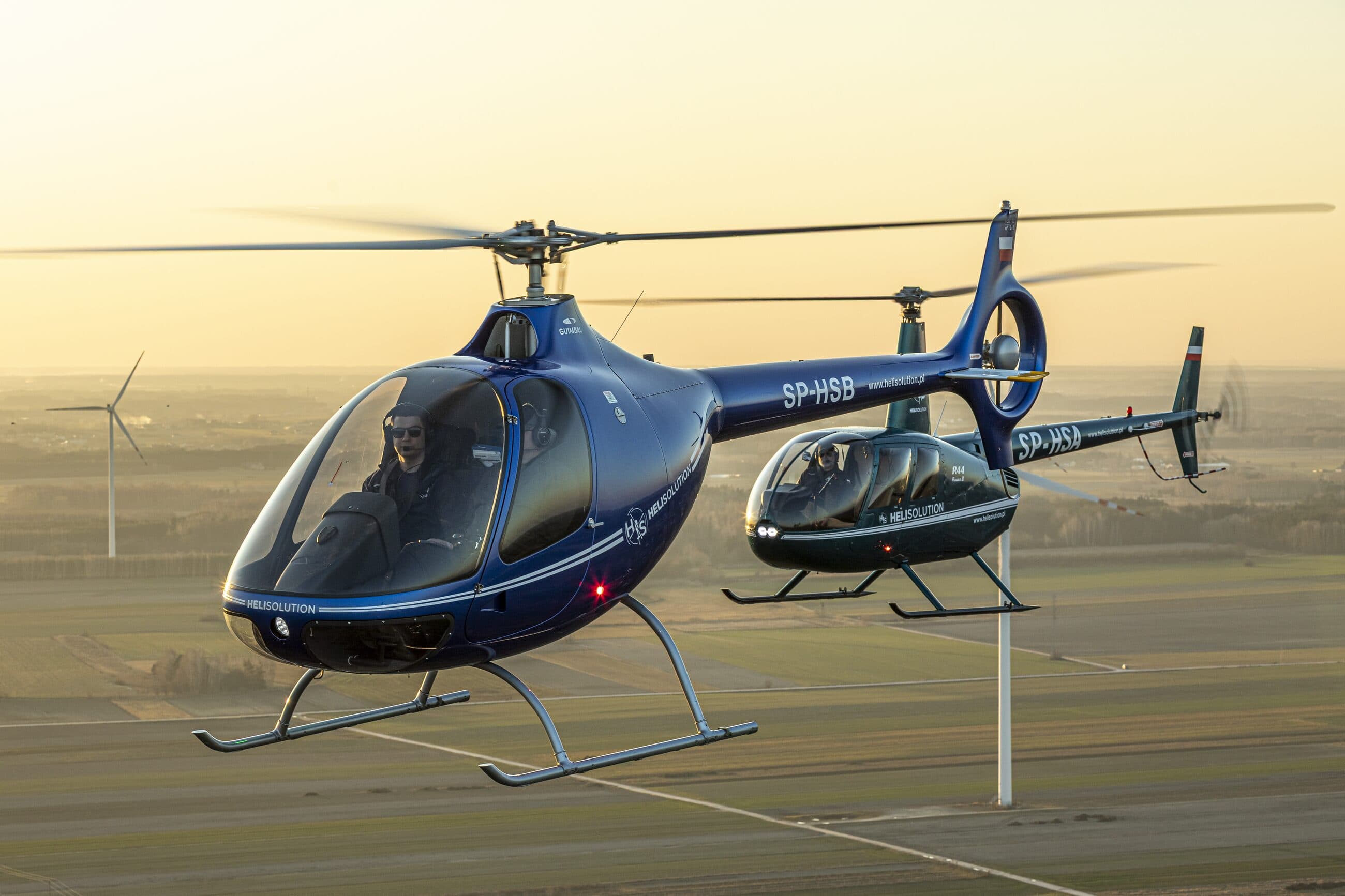 Guimbal Cabri G2 and Robinson R44 of Heli Solution flying in formation